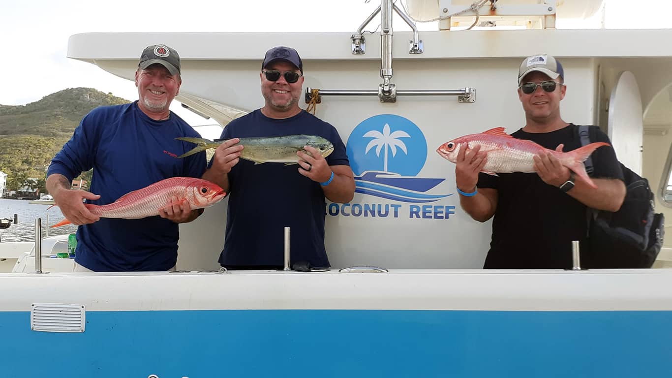 Crew and Guests with Coconut Reef Show off their catch